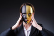 Woman with mask in hypocrisy concept
