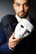 Man with black mask in studio