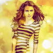 Young sensual model girl. Color face art studio photo.