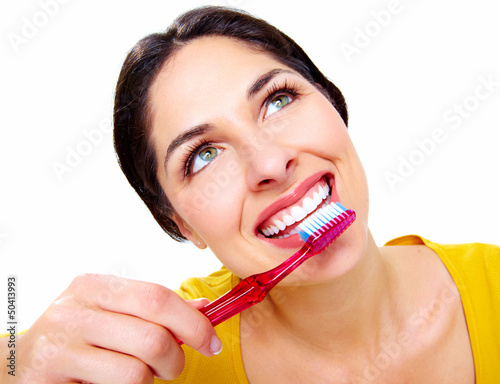 Photo: Beautiful woman with a toothbrush. Beautiful woman with a toothbrush.