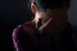 girl crying in the darkness