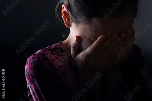 Photo: girl crying in the darkness girl crying in the darkness