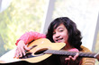 Male adult playing guitar