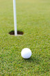 Golf ball on green grass