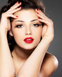 Beauty fashion woman with red nails and makeup
