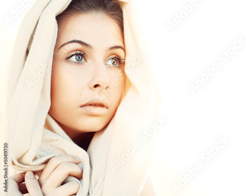 Photo: Beautiful young woman enjoying the sunlight Beautiful young woman enjoying the sunlight
