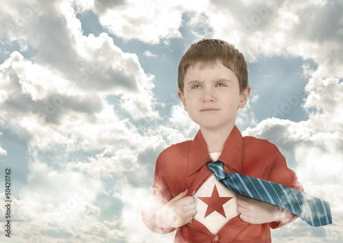 Photo: Superhero Boy Child with Open Shirt and Clouds Superhero Boy Child with Open Shirt and Clouds