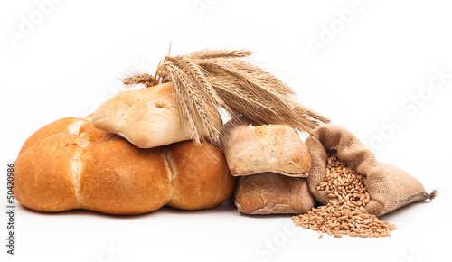 Photo: assortment of baked bread isolated on white background assortment of baked bread isolated on white background