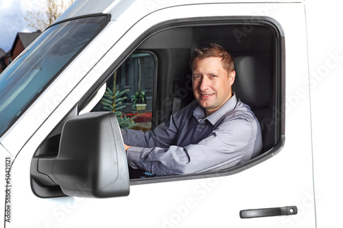 Photo: Handsome truck driver. Handsome truck driver.