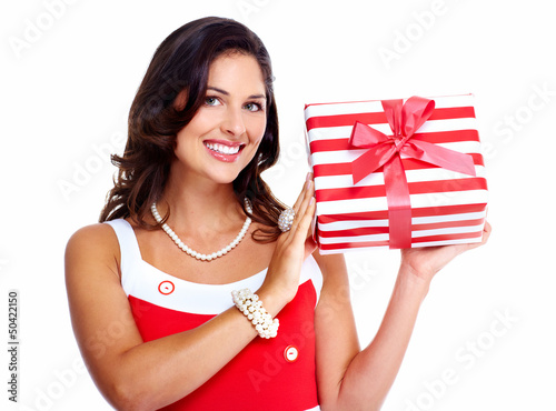 Photo: Beautiful young girl with a Christmas present. Beautiful young girl with a Christmas present.
