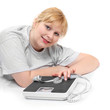 Overweight woman with measure tape on a white background.