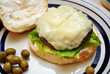 Juicy Cheeseburger with Green Olives on the Side