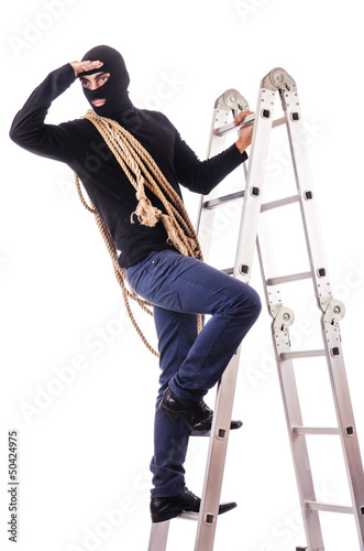 Photo: Burglar wearing balaclava isolated on white Burglar wearing balaclava isolated on white