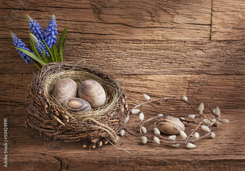 Photo: Easter eggs in nest Easter eggs in nest
