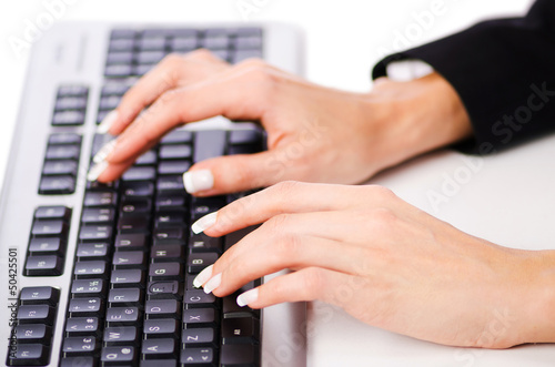 Photo: Hands working on the keyboard Hands working on the keyboard