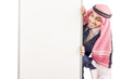 Arab man with blank board for message