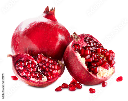 Photo: Pomegranates isolated on a White Background. Organic Bio fruits Pomegranates isolated on a White Background. Organic Bio fruits