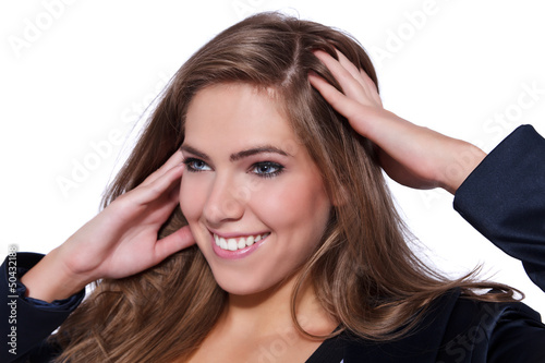Photo: Portrait of a young beautiful woman massaging her head Portrait of a young beautiful woman massaging her head