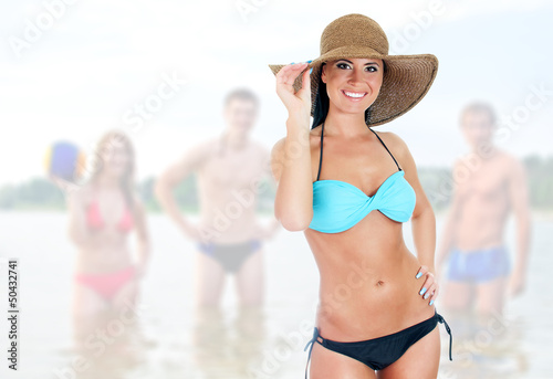 Photo: Pretty woman in bikini on sea landscape background Pretty woman in bikini on sea landscape background