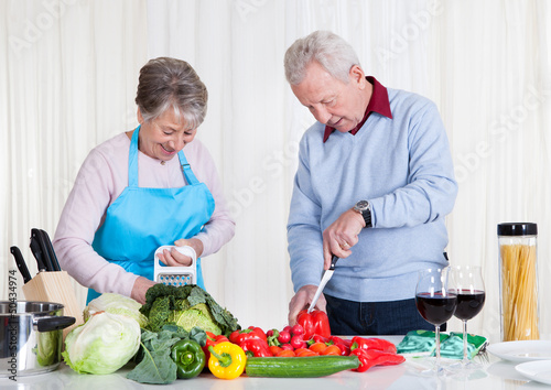 Photo: Senior Couple Cutting Vegetables Senior Couple Cutting Vegetables