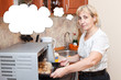 Photo: Senior woman in domestic kitchen with blank thought clouds Senior woman in domestic kitchen with blank thought clouds