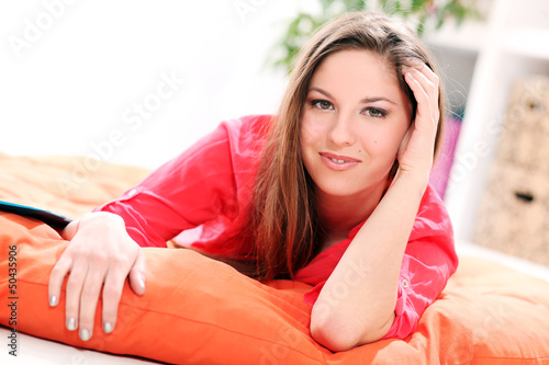 Photo: Portrait of happy young woman Portrait of happy young woman