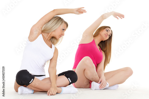 Photo: Sporty women do exercises. Fitness. Sporty women do exercises. Fitness.