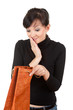 young woman with curiosity looking to present bag