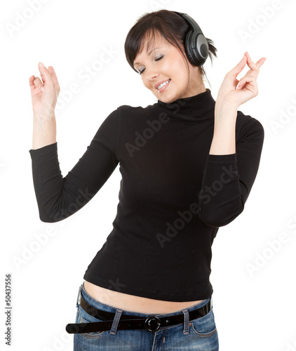 Photo: young woman with headphones listening to music young woman with headphones listening to music