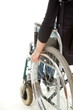 hands of a young woman sitting on a wheelchair