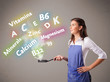 Young woman cooking vitamins and minerals