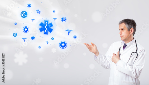 Photo: Doctor with blue medical icons Doctor with blue medical icons