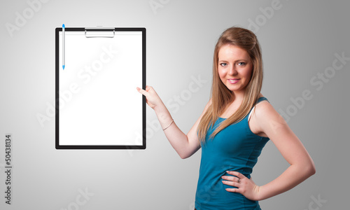 Photo: Young girl holding black folder with white sheet copy space Young girl holding black folder with white sheet copy space