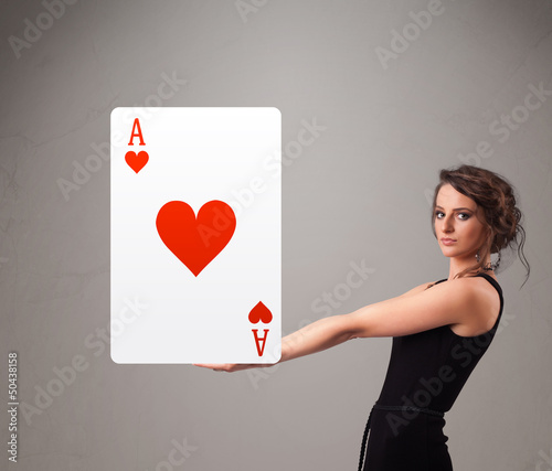 Photo: Beautifu woman holding a red heart ace Beautifu woman holding a red heart ace
