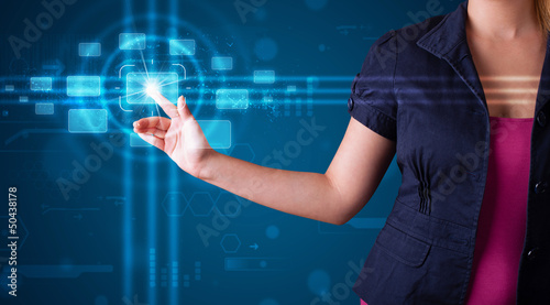 Photo: Woman pressing high tech type of modern buttons Woman pressing high tech type of modern buttons