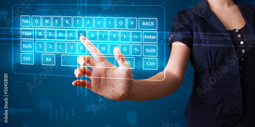 Photo: Girl pressing virtual type of keyboard Girl pressing virtual type of keyboard