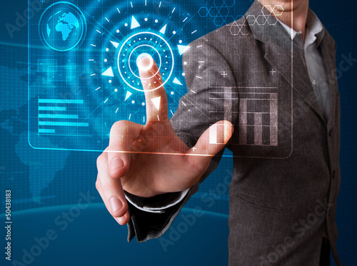 Photo: Businessman pressing high tech type of modern buttons Businessman pressing high tech type of modern buttons