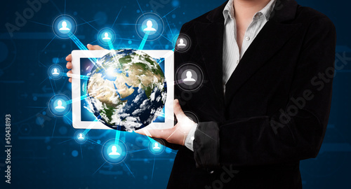 Photo: Woman presenting 3d earth globe in modern tablet Woman presenting 3d earth globe in modern tablet