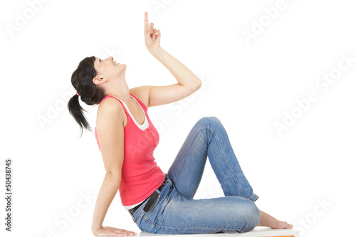 Photo: happy young woman poining up, full lenght happy young woman poining up, full lenght