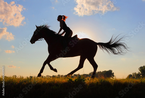 Photo: Horseback riding at sunset Horseback riding at sunset