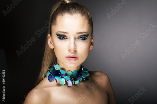 Photo: Luxury. Gorgeous Trendy Woman with Turquoise Necklace Luxury. Gorgeous Trendy Woman with Turquoise Necklace