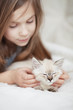Photo: Child and kitten Child and kitten