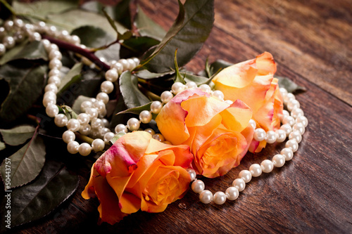 Photo: Orange roses in pearls Orange roses in pearls