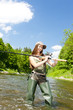 Photo: woman fishing in river, Czech Republic woman fishing in river, Czech Republic