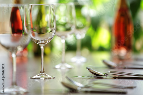 Photo: Wine glass and place settings Wine glass and place settings