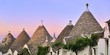 Quadro Alberobello - trulli al tramonto Quadro Alberobello - trulli al tramonto