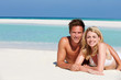 Photo: Couple Enjoying Beach Holiday Couple Enjoying Beach Holiday