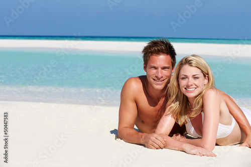 Photo: Couple Enjoying Beach Holiday Couple Enjoying Beach Holiday