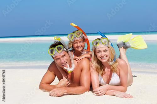 Photo: Family With Snorkels Enjoying Beach Holiday Family With Snorkels Enjoying Beach Holiday