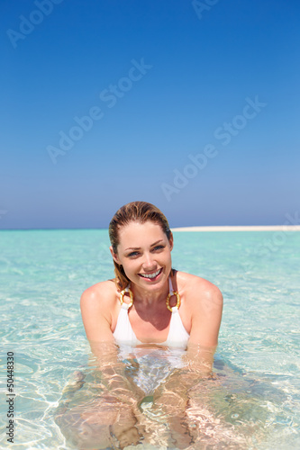 Photo: Woman Enjoying Beach Holiday Woman Enjoying Beach Holiday